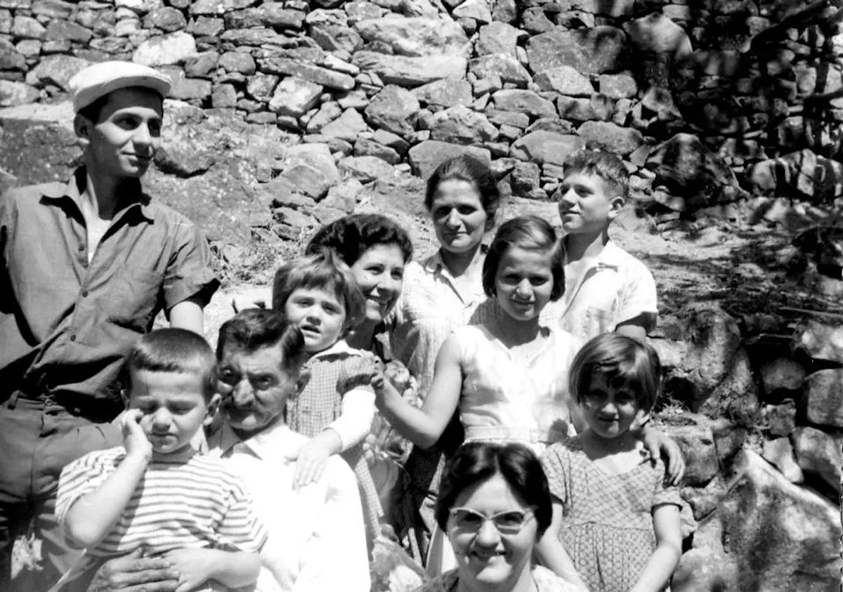 a group of people posing for a photo in front of a crowd